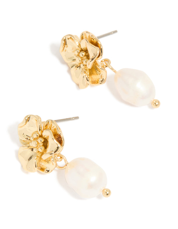Elegant gold plated freshwater pearl flower drop earrings featuring floral design in statement style with ivory accents front view