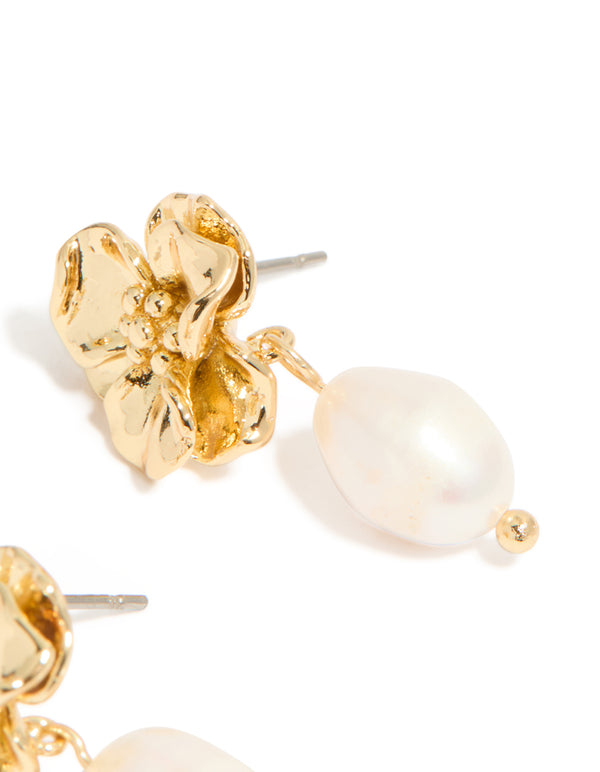 Graceful gold plated freshwater pearl flower drop earrings with floral design and statement ivory accents post detail view