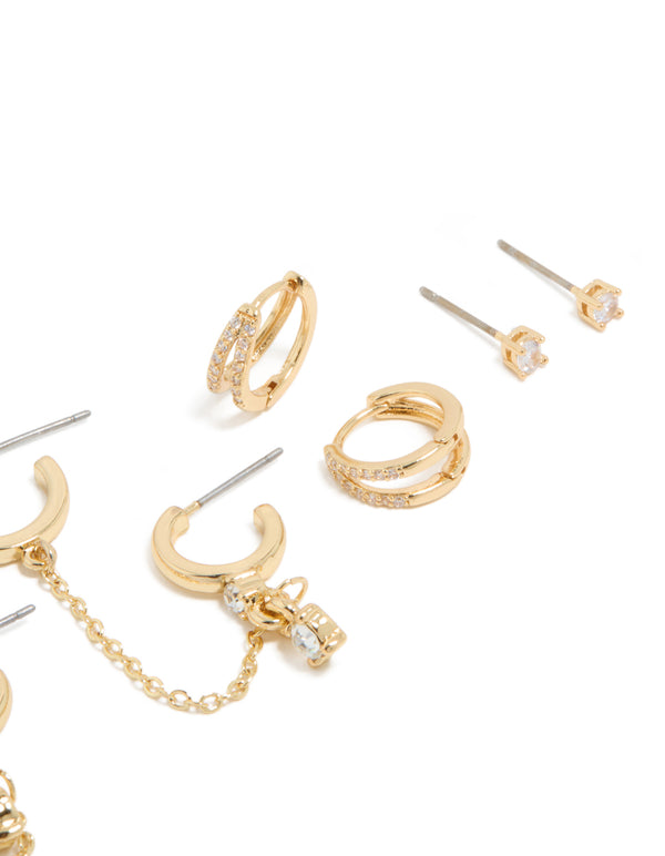 Elegant gold plated cubic zirconia huggie and chain earrings in a 5-pack featuring crystal embellishments and mixed hoop and stud closures close up view