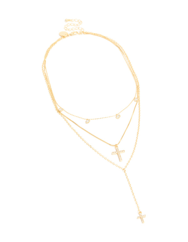 Elegantly designed cubic zirconia droplet and cross layered Y-necklace featuring charm in gold plated statement style close up view