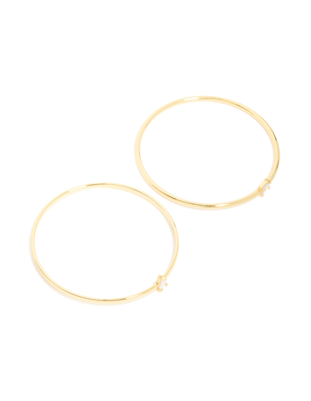 Featuring gold plated cubic zirconia rectangle and teardrop bangles in a 2-pack accents front view