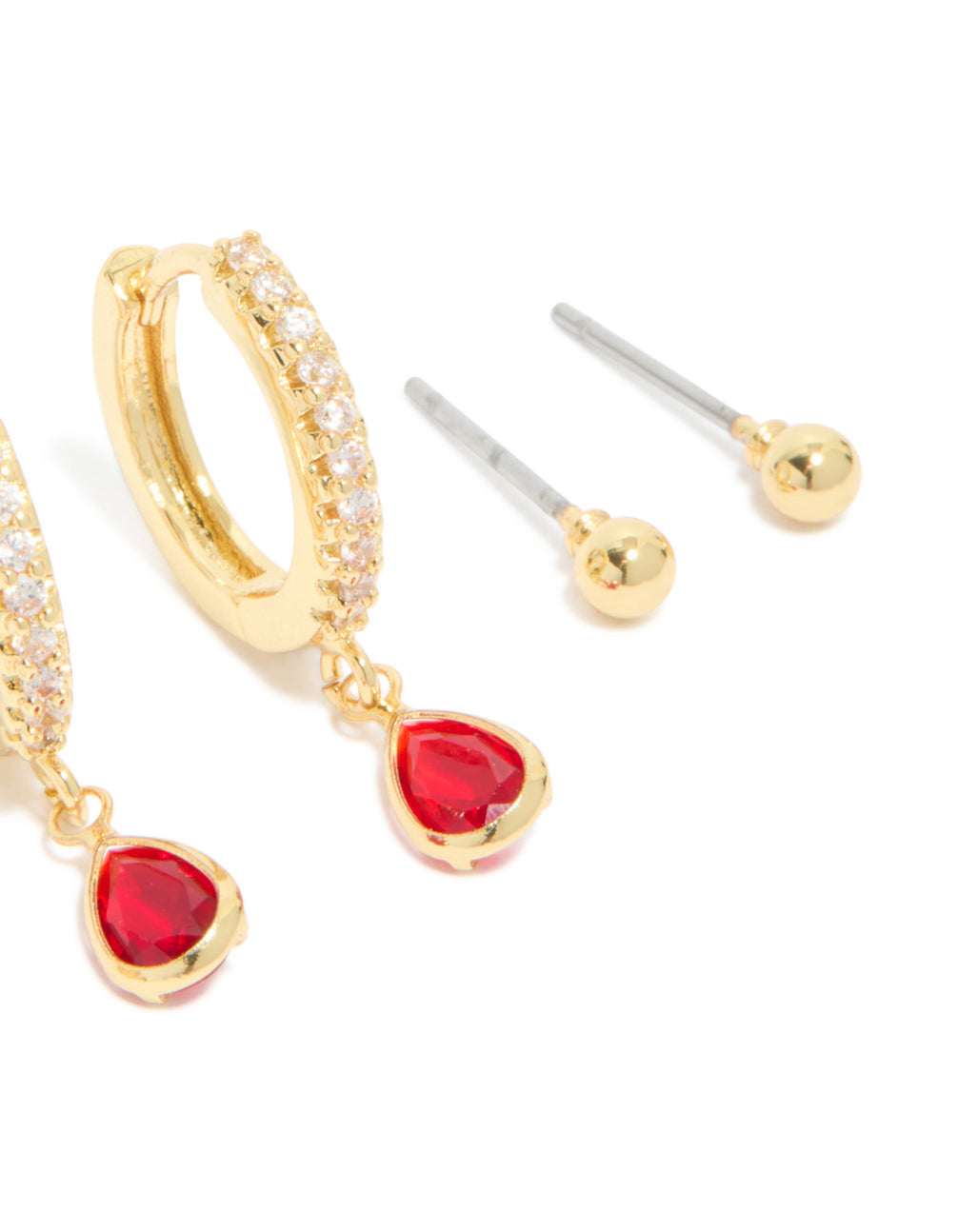 Highlighting huggie stud crystal cubic zirconia garnet birthstone earrings made from gold plated brass in red and clear post detail view