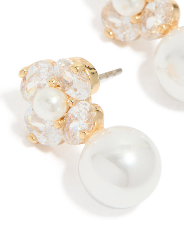Detailed view of gold plated cubic zirconia flower and pearl drop earrings clear and ivory accents close up view