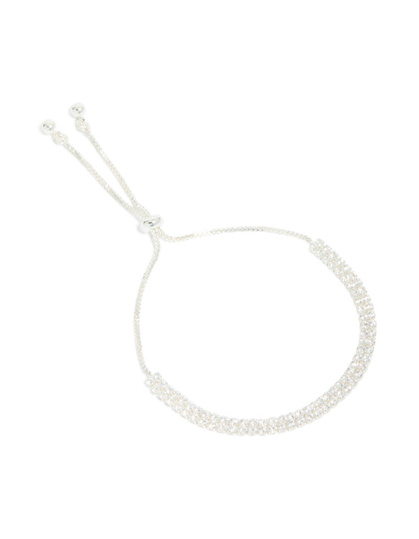 Featuring a silver plated cubic zirconia thin tennis layered toggle bracelet front view