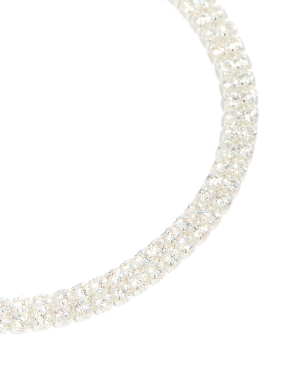 Crafted from silver plated cubic zirconia thin tennis layered toggle bracelet close up view