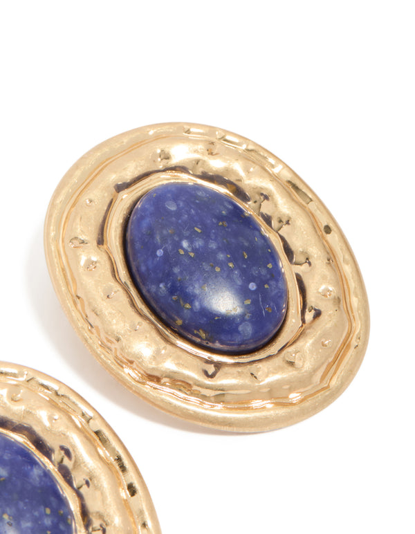 Designed with worn gold round hammered dark blue acrylic stud earrings featuring statement style close up view