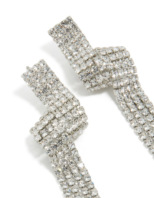 Designed with tassel statement silver diamante shiny zigzag drop earrings showcasing intricate stonework close up view