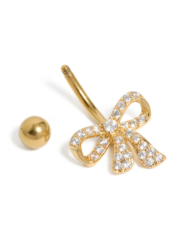 Surgical steel belly bar crafted from gold plated material with bow and cubic zirconia pavé detail view