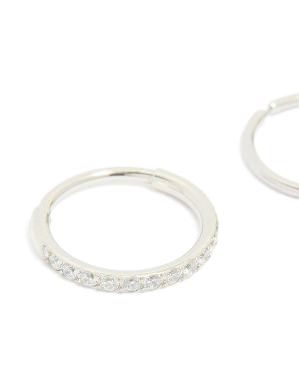 Showcasing surgical steel cubic zirconia hinged and plain nose rings in a 2-pack with diamond accents and silver finish close up view