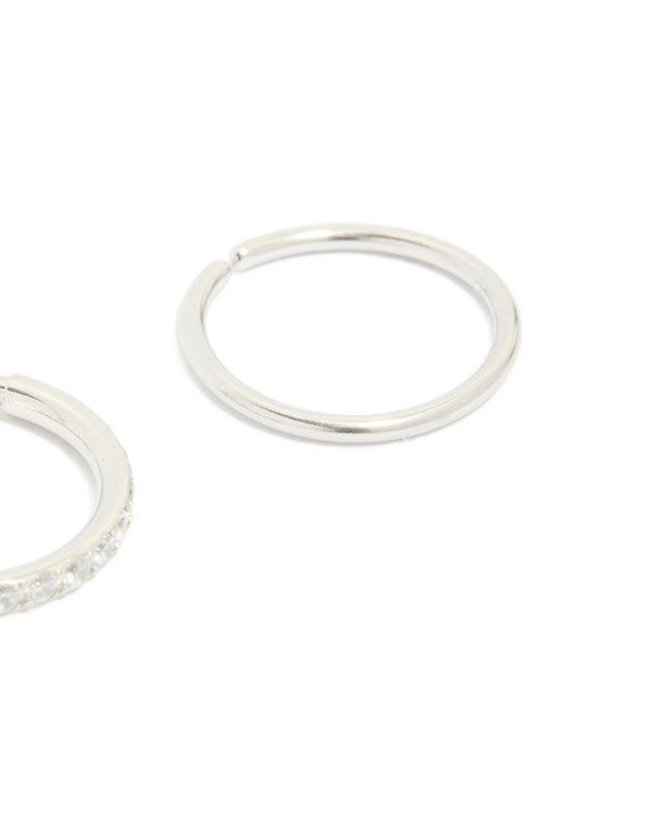 Showcasing surgical steel cubic zirconia hinged and plain nose rings in a 2-pack with diamond accents and silver finish close up view