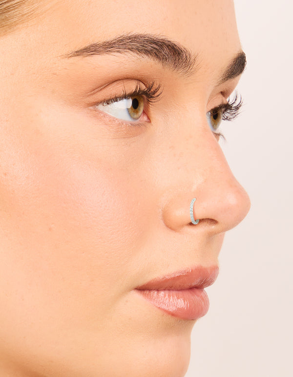 Discover surgical steel cubic zirconia hinged and plain nose rings in a 2-pack with diamond embellishments and silver finish nose view