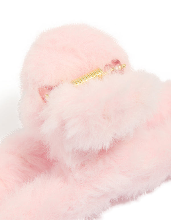 Crafted from pink faux fur fabric claw clip detail view
