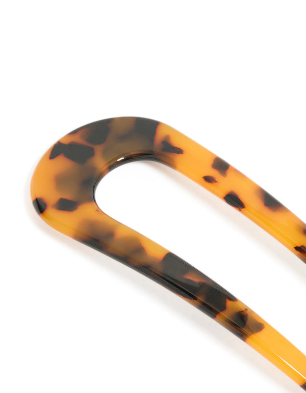 Showcasing a tortoiseshell acrylic large basic hair pin with animal-leopard print in goldenrod, chocolate, and black side view