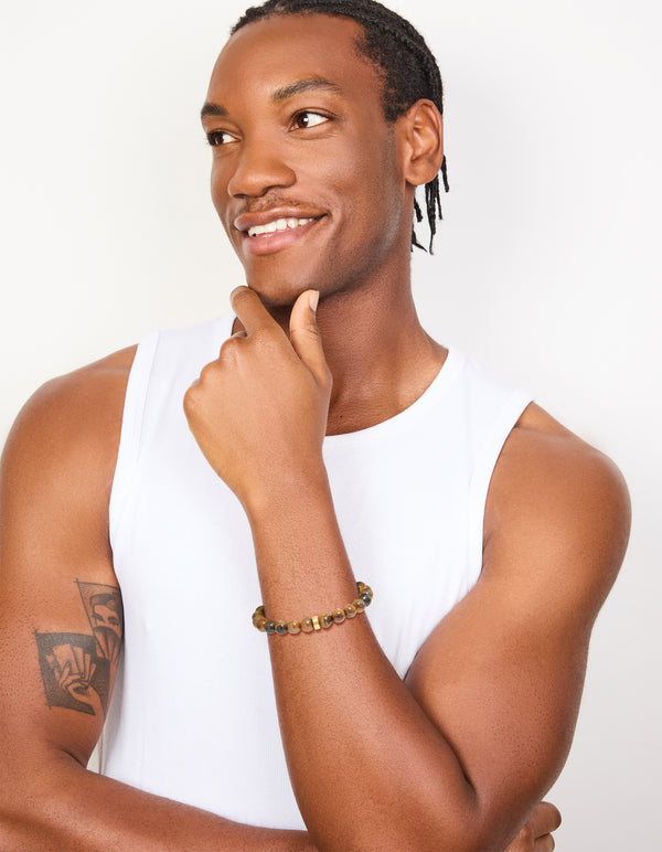Designed with a mens waterproof stainless steel tiger's eye beaded bracelet on model view