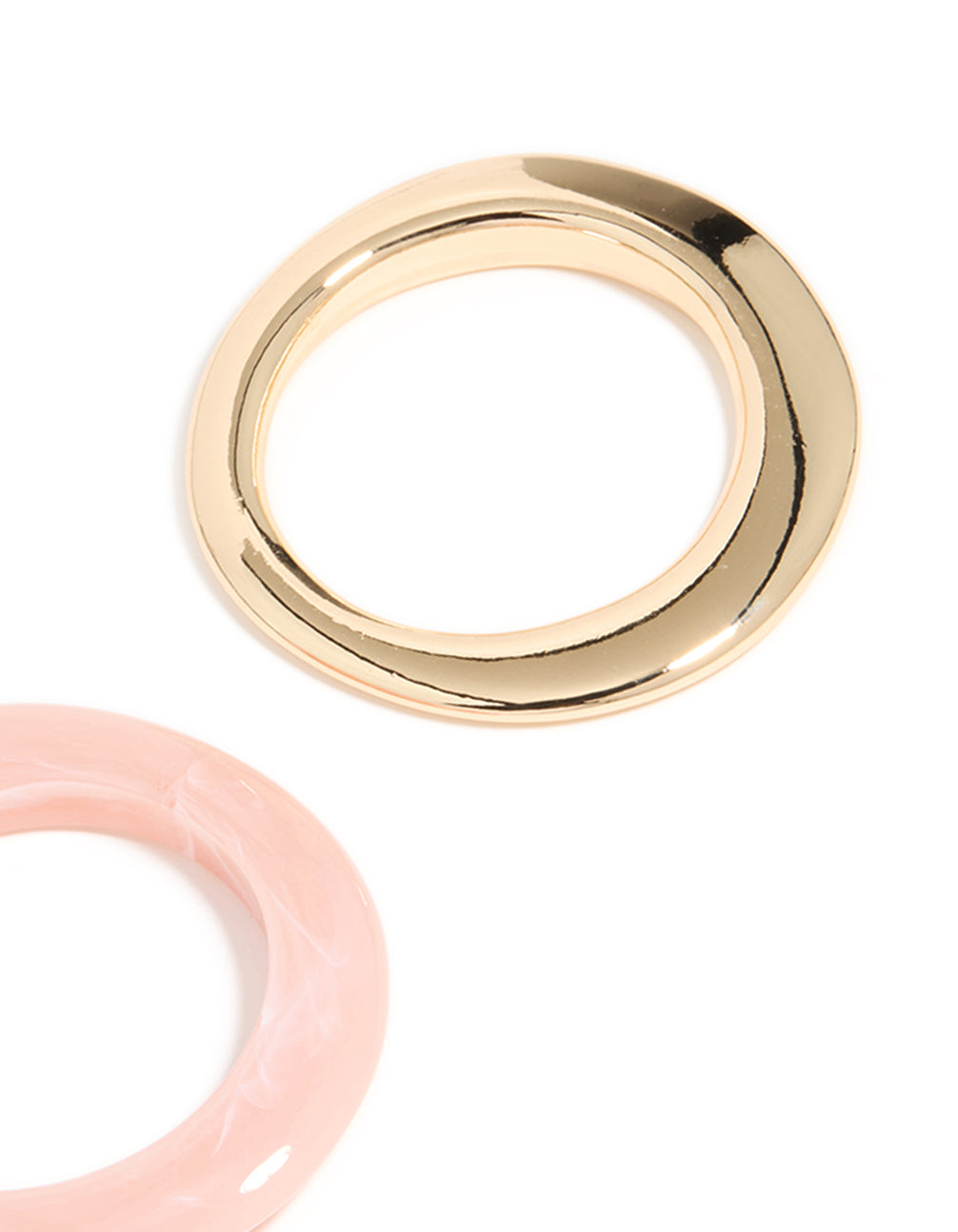 Showcasing a 2-pack of chunky acrylic bangles in gold and pink close up view
