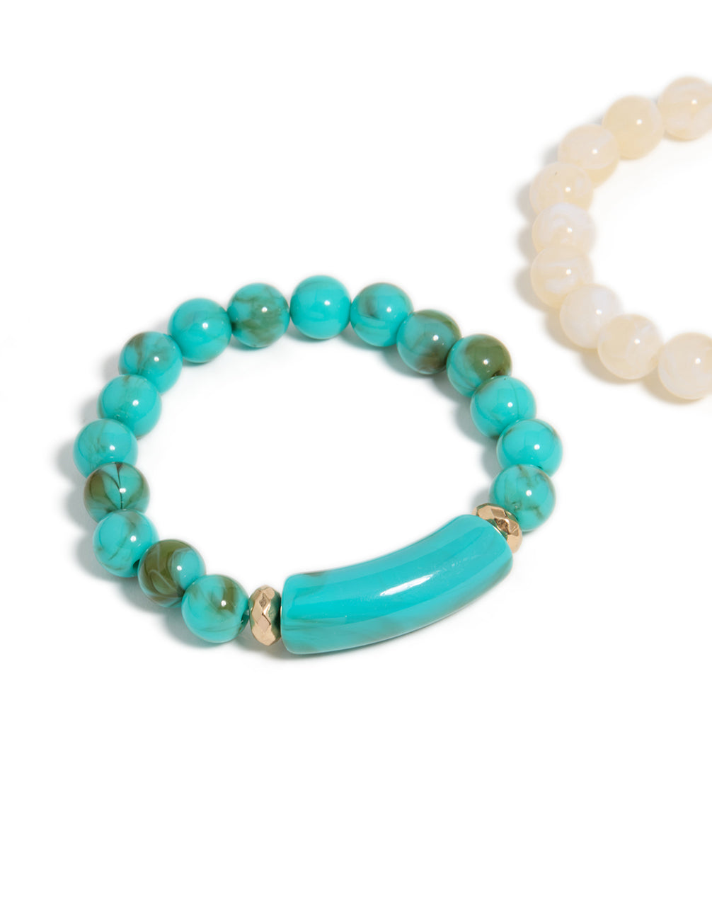 See this turquoise and neutral beaded stretch bracelet 2-pack featuring gold accents in close up view