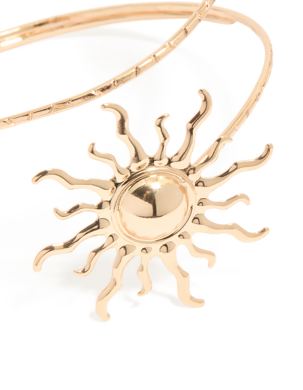 Crafted from gold, this double sun arm cuff features celestial motifs in a statement style in close up view