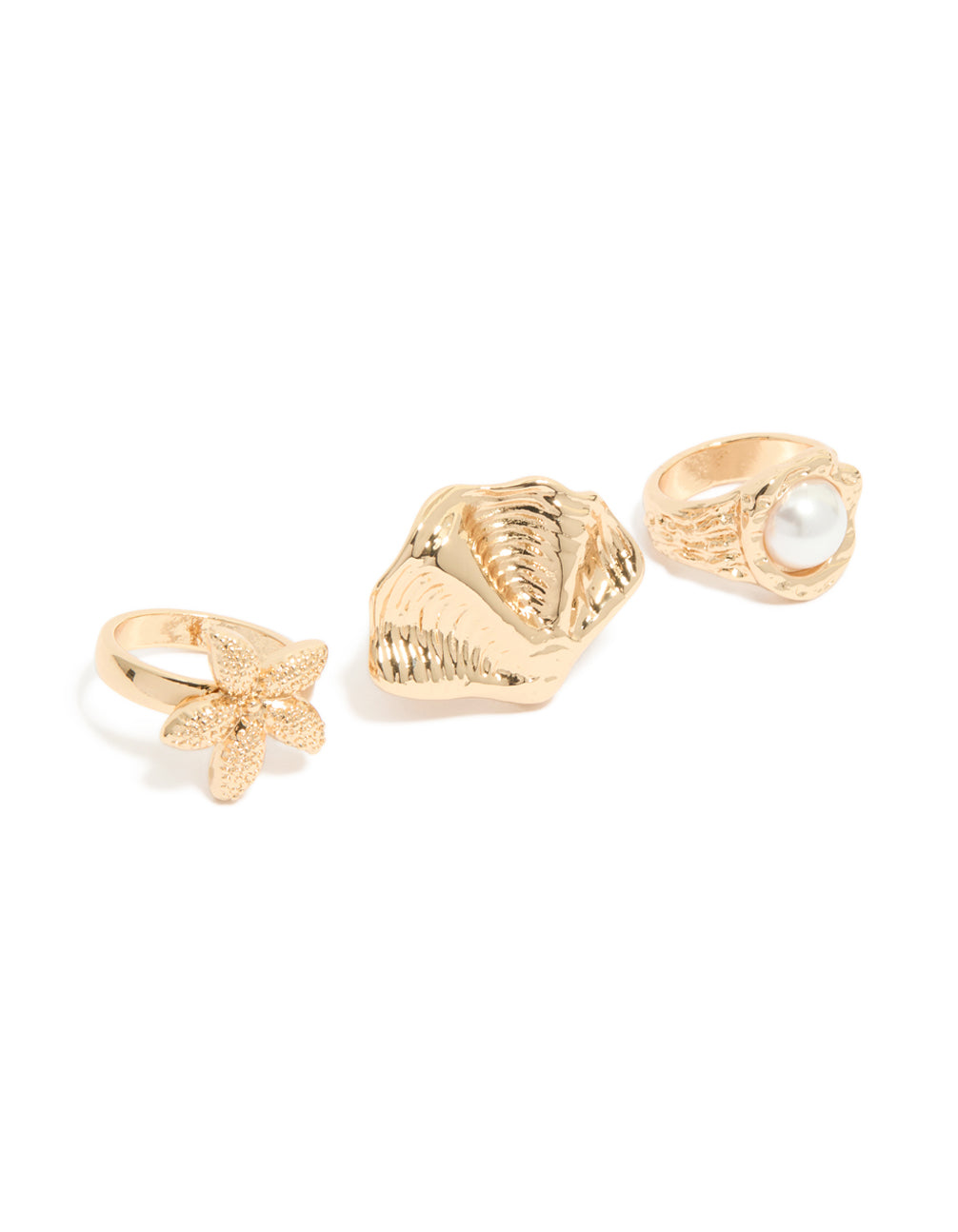 Explore gold textured starfish and shell rings in a 3-pack with pearl statement design front view