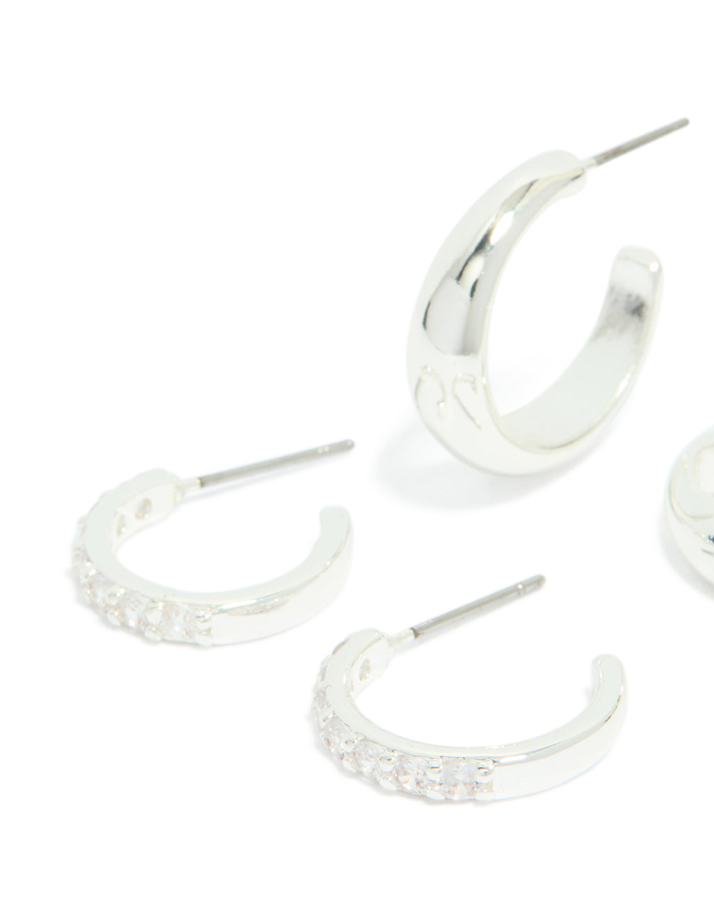 Crafted from silver plated material, cubic zirconia and smooth hoop earrings 2-pack with crystal accents close up view