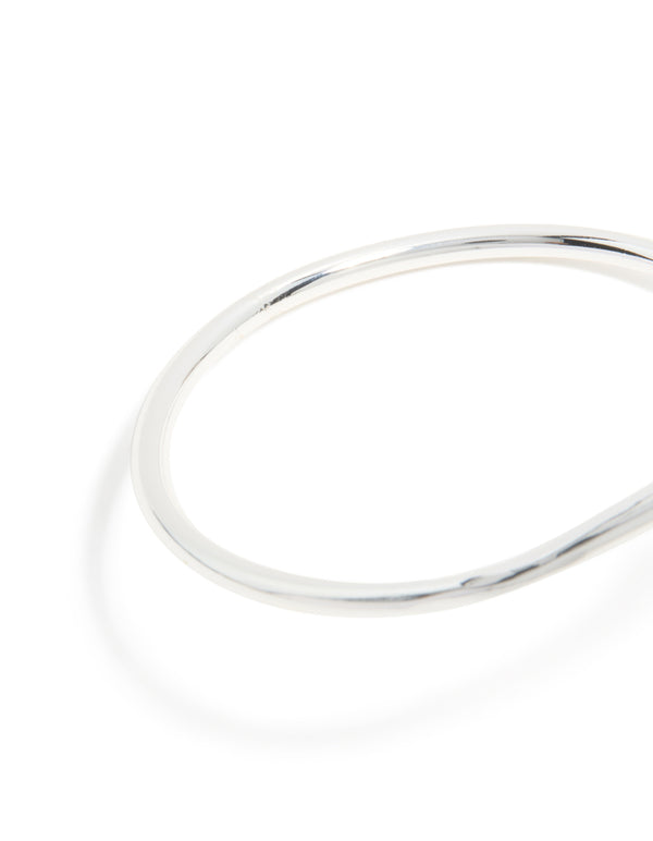 Designed with a silver plated curved wrap hinged bangle featuring smooth texture close up view