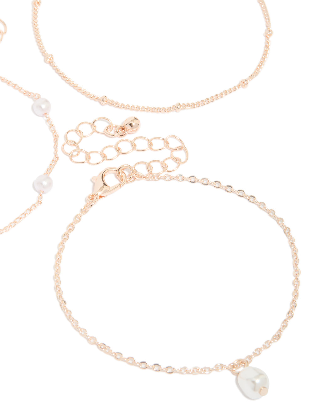 Showcasing rose gold pearl and station droplet bracelets in a 3-pack closure detail view