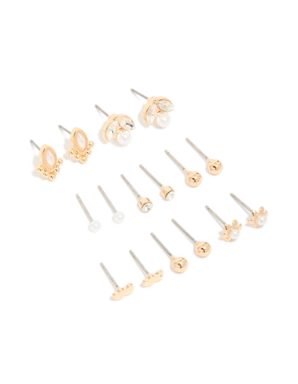 Showcasing gold diamante and pearl stud earrings in an 8-pack featuring ball and floral elements front view