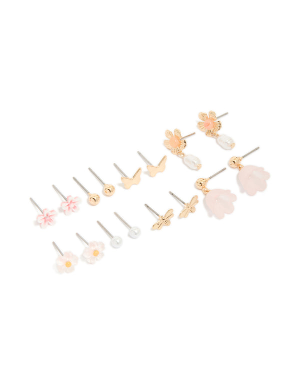 Showcasing a set of gold pearl and floral stud earrings 8-pack featuring butterfly accents with stud closure front view