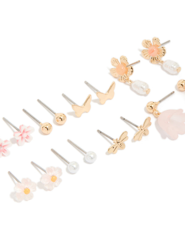 Highlighting gold pearl and floral stud earrings 8-pack with butterfly accents and stud closure close up view