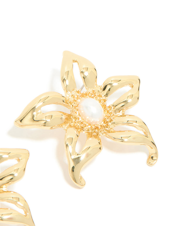Featuring gold plated statement pearl flower earrings with white center and textured petals post detail view