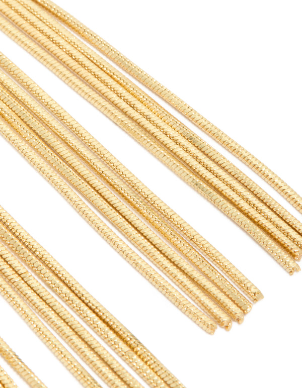 Designed with a knot stud, these gold plated statement fringe earrings close up view