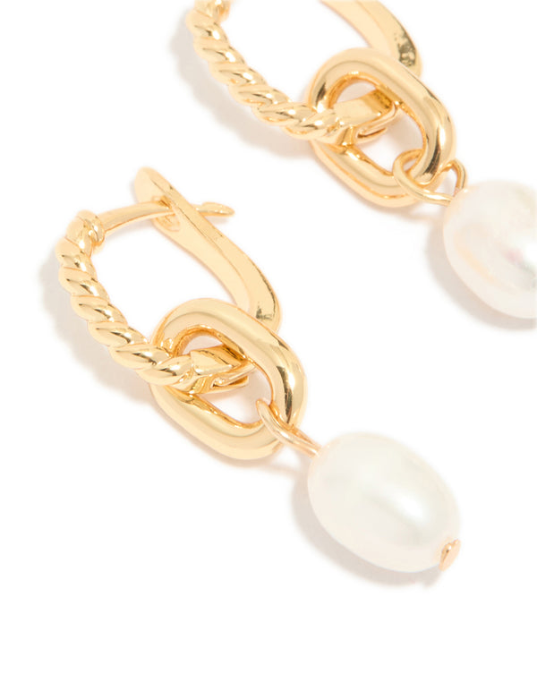 Designed with gold plated textured freshwater pearl drop huggie earrings showcasing hoop closure close up view
