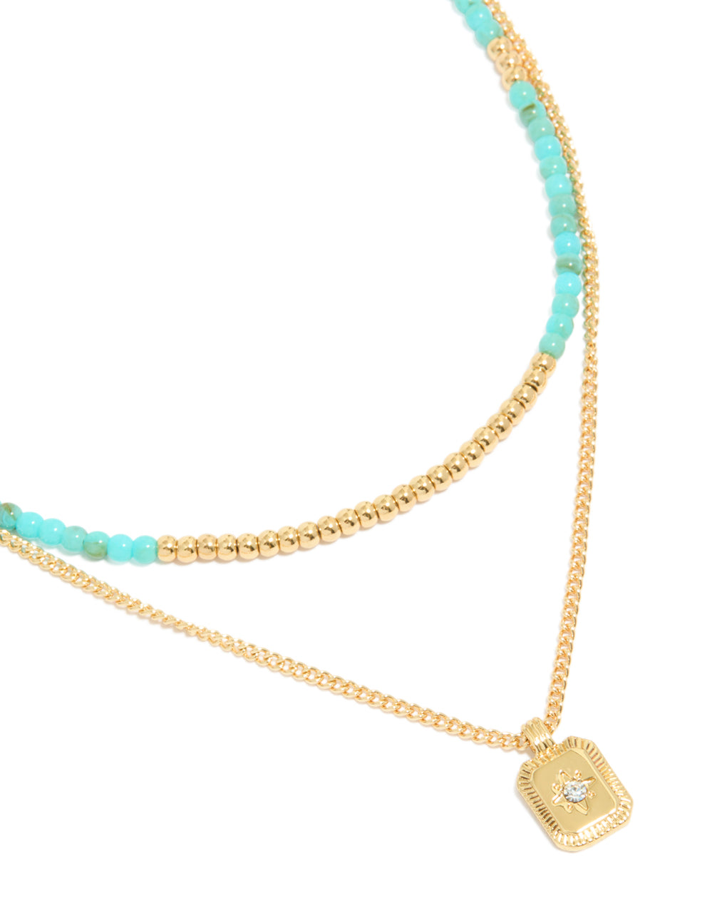 Showcasing a gold plated blue beaded layered necklace with celestial pendant featuring star detail and cubic zirconia in statement style close up view