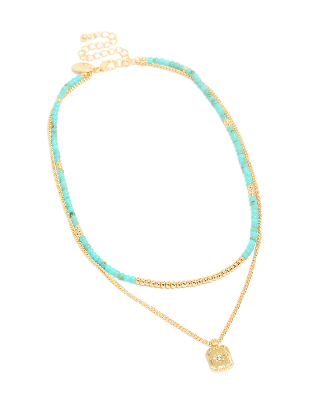 Featuring a gold plated blue beaded layered necklace with celestial pendant featuring star detail and cubic zirconia in statement style front view