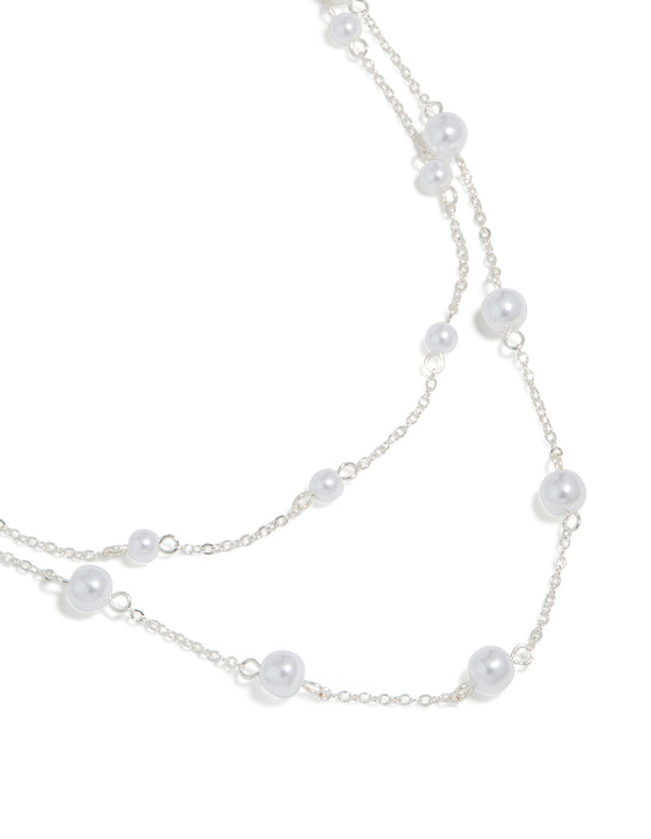 Discover this silver pearl layered necklace featuring close up view