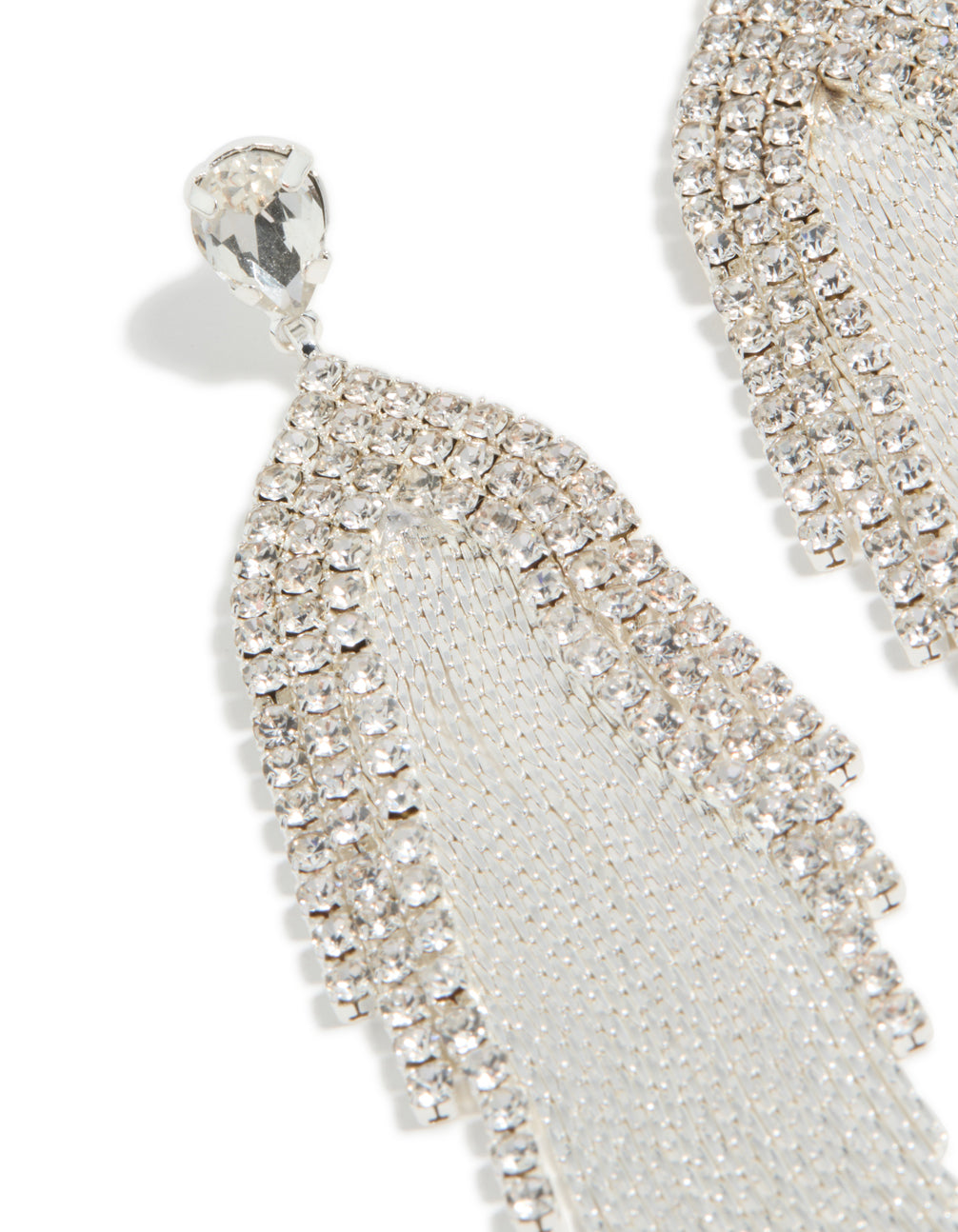 Showcasing silver diamante dazzle chain drop earrings with tassel in a statement style close up view