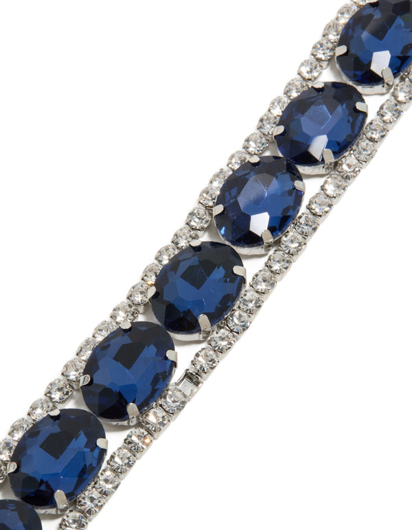 Crafted from silver with blue diamantes, this statement bracelet is shown in close up view