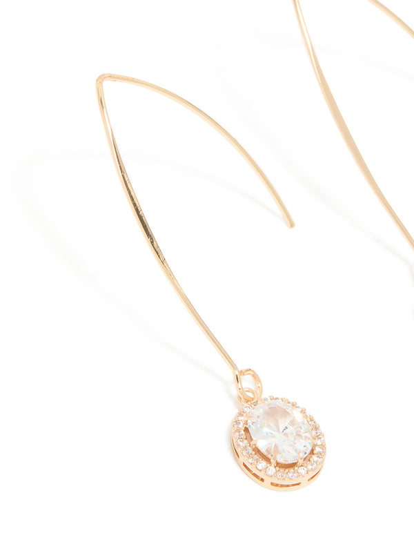 Designed with cubic zirconia, gold dainty circle drop earrings shown in close up view