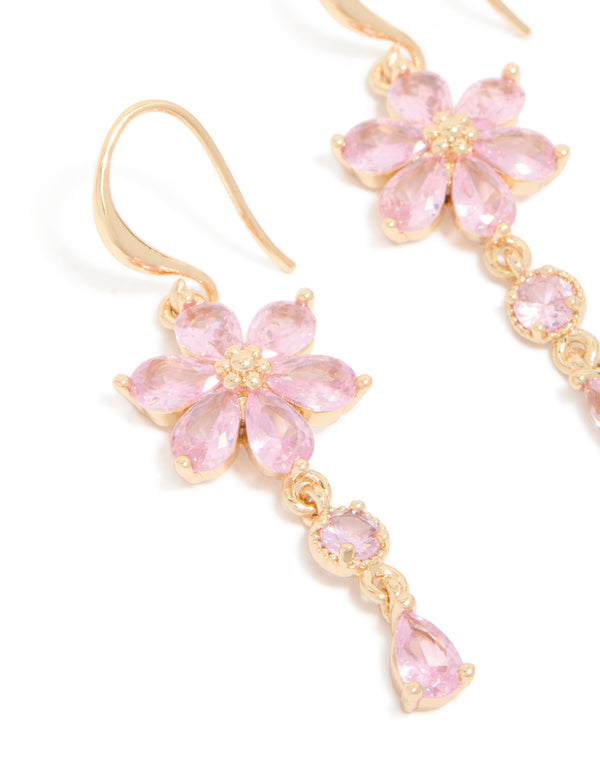 Highlighting gold pink cubic zirconia flower hook earrings close up view