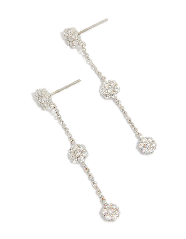 Elegant silver cubic zirconia mini floral drop earrings featuring delicate chain and flower cluster details front view