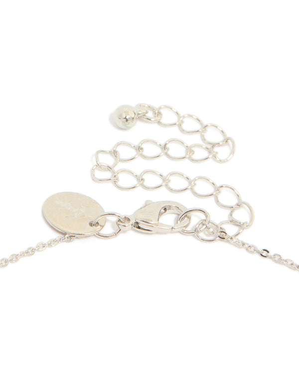 Highlighting the lobster claw clasp and extender chain of cubic zirconia mini floral y necklace in dainty silver clasp detail view
