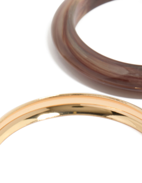 Showcasing gold and acrylic bangles 4-pack with brown detailing close up view