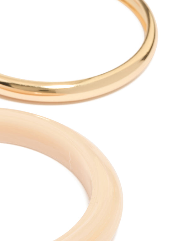 Showcasing gold and acrylic bangles 4-pack with brown detailing close up view