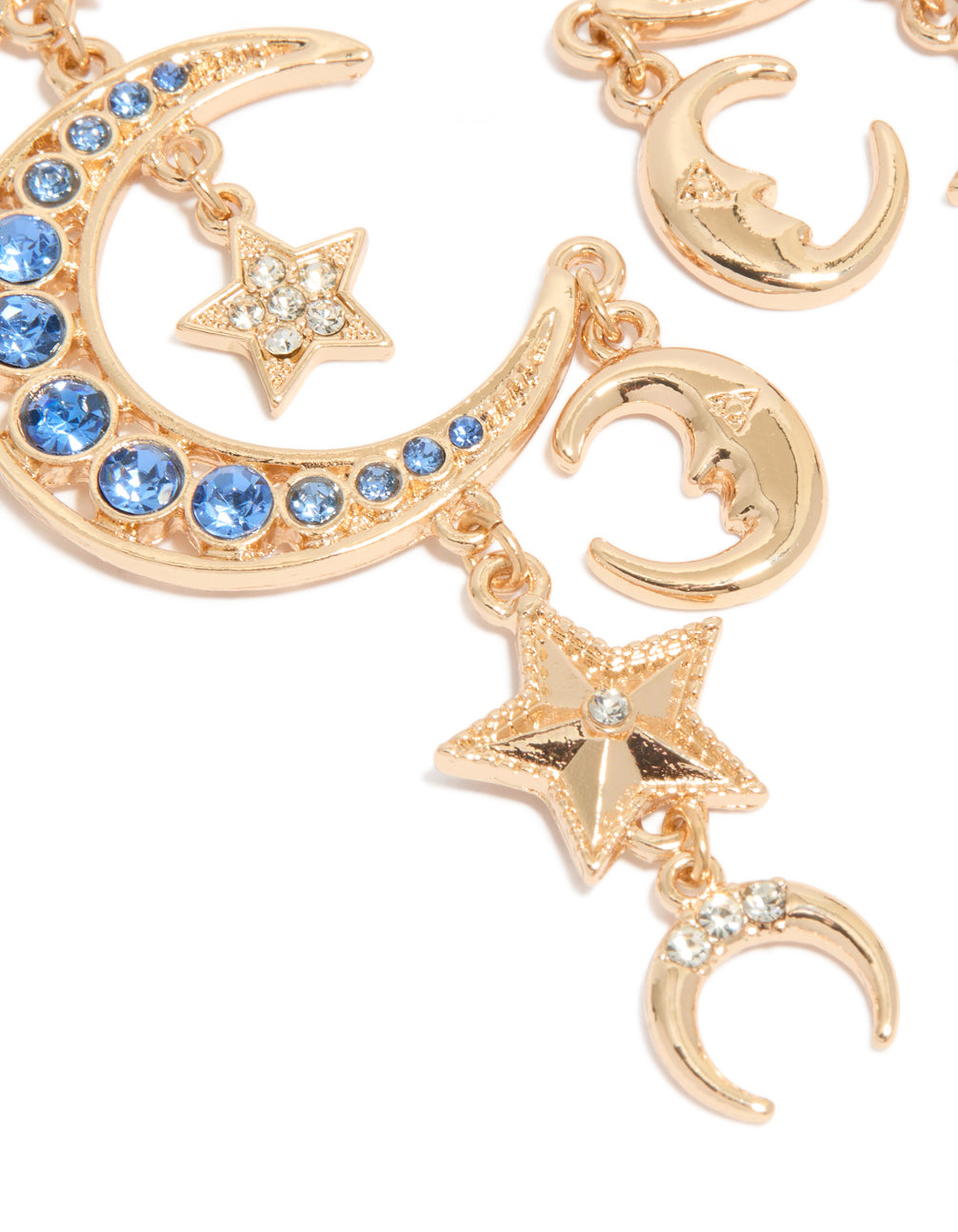 Elegant statement gold and blue diamante drop earrings with celestial charm featuring moon and star motifs close up view