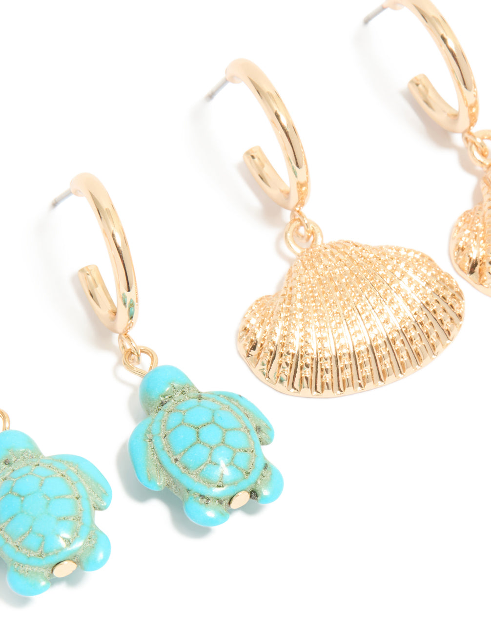 Detailed view of gold sea life huggie earrings in a 3-pack with ocean shell animal features close up view