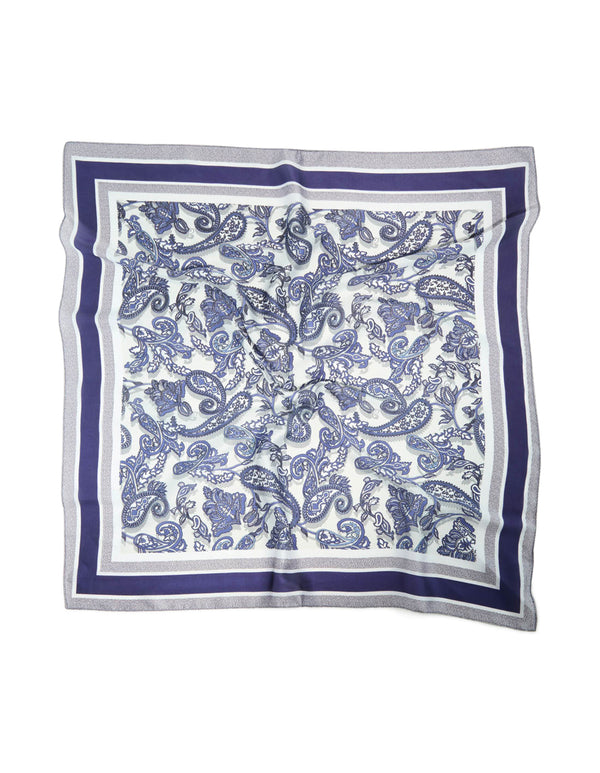 Elegant white and blue fabric scarf featuring paisley print in royal blue, front view
