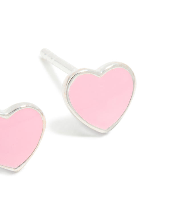 Featuring sterling silver pink enamel heart stud earrings in dainty style with stud closure shown close up view