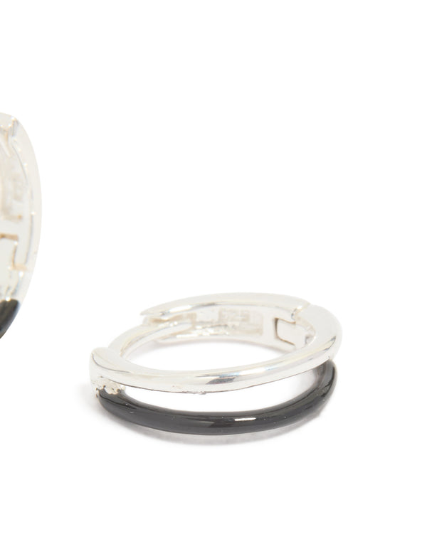 Showcasing statement hoop earrings in sterling silver with black enamel and stud closure post detail view