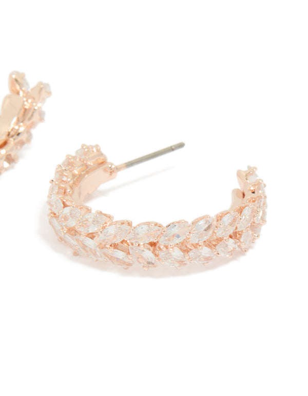 Close examination of cubic zirconia medium leaf hoop earrings in rose gold plated construction with post closure post detail view