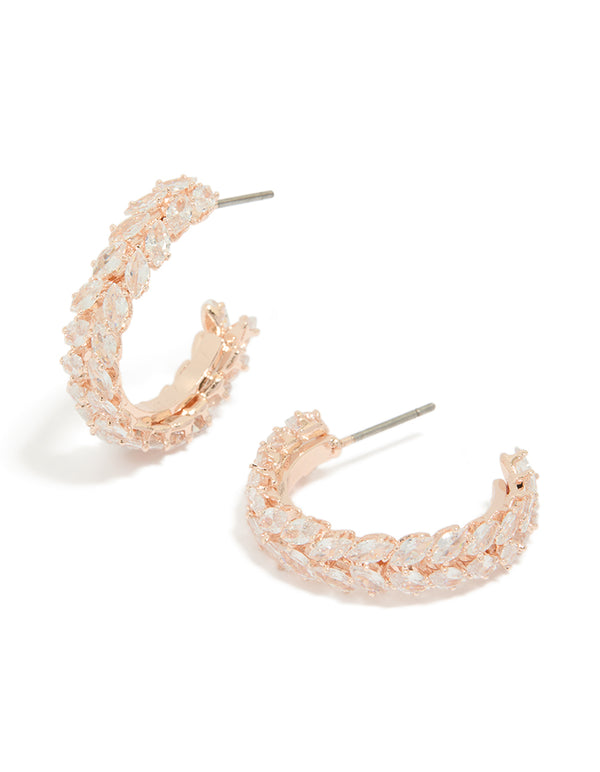 Showcasing leaf-adorned medium hoop earrings in rose gold plated finish with cubic zirconia stones front view