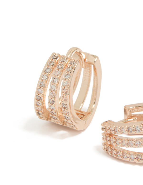 A close-up of rose gold plated cubic zirconia layered hoop earrings close up view
